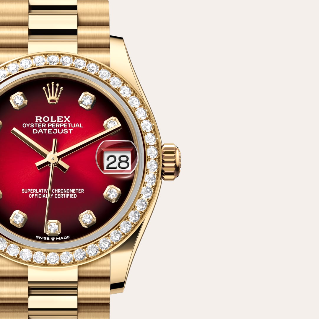 Rolex Datejust 31 in 18 kt yellow gold with a red ombré set with diamonds dial, set with diamonds bezel, and President bracelet.