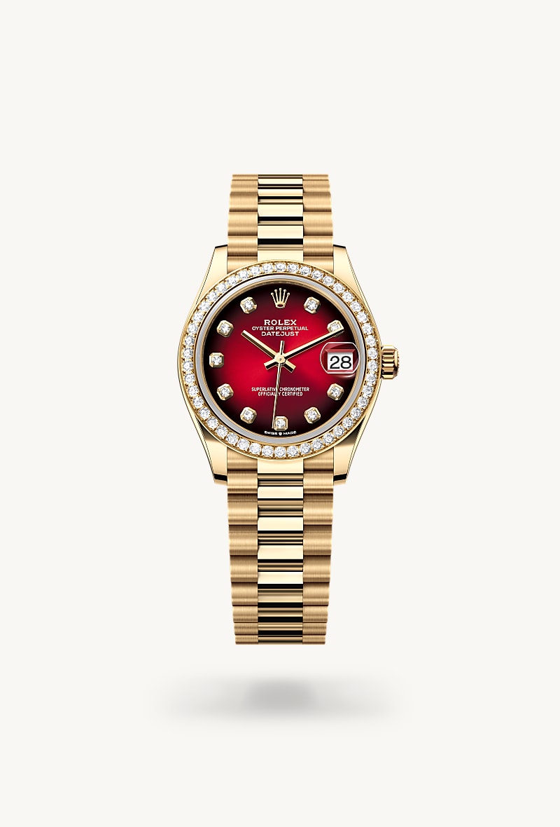 Rolex Datejust 31 in 18 kt yellow gold with a red ombré set with diamonds dial, set with diamonds bezel, and President bracelet.