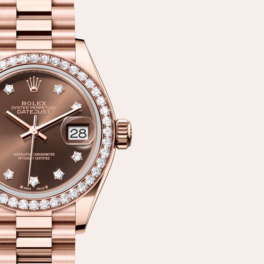 Rolex Lady-Datejust in 18 kt Everose gold with a chocolate set with diamonds dial, set with diamonds bezel, and President bracelet.