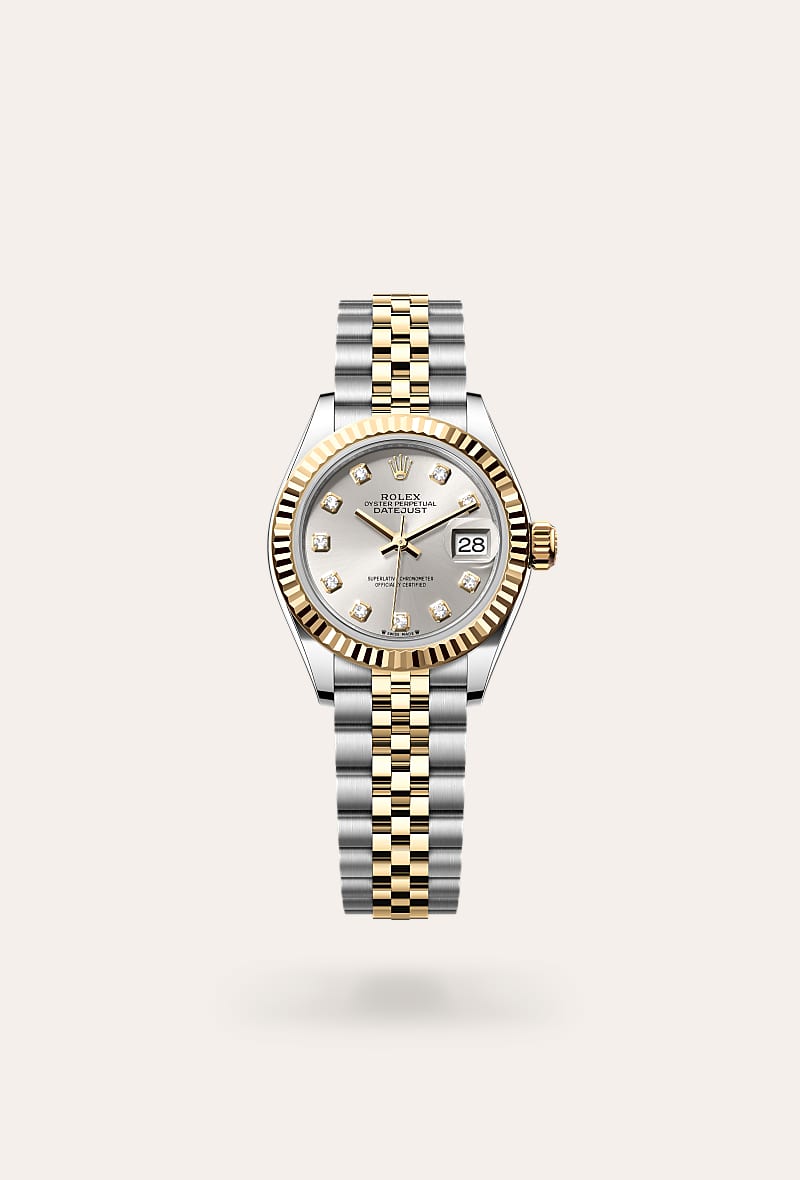 Rolex Lady-Datejust in Yellow Rolesor with a silver set with diamonds dial, fluted bezel, and Jubilee bracelet.