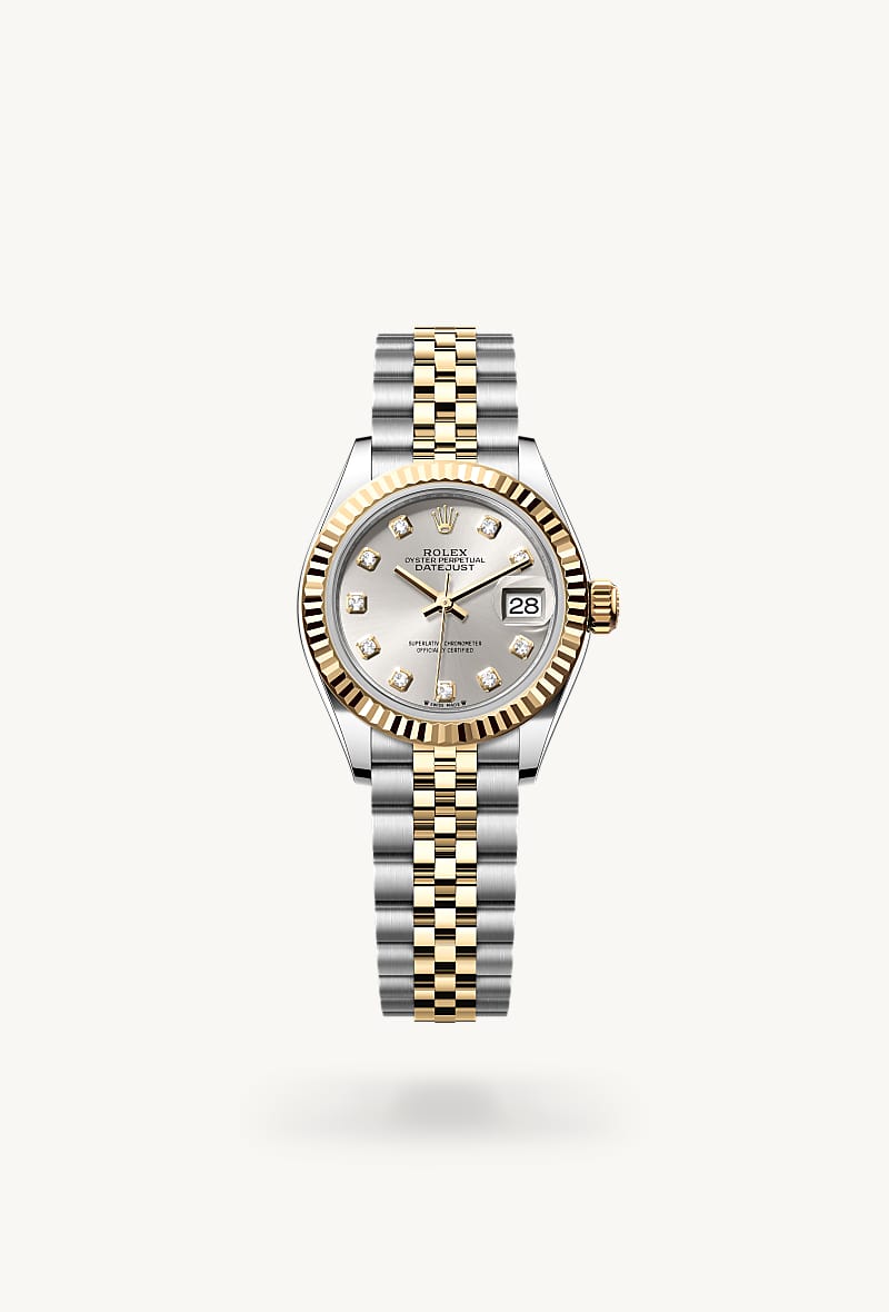 Rolex Lady-Datejust in Yellow Rolesor with a silver set with diamonds dial, fluted bezel, and Jubilee bracelet.