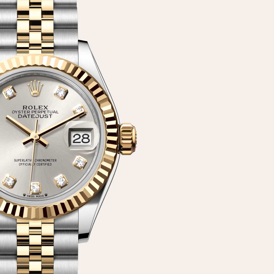Rolex Lady-Datejust in Yellow Rolesor with a silver set with diamonds dial, fluted bezel, and Jubilee bracelet.