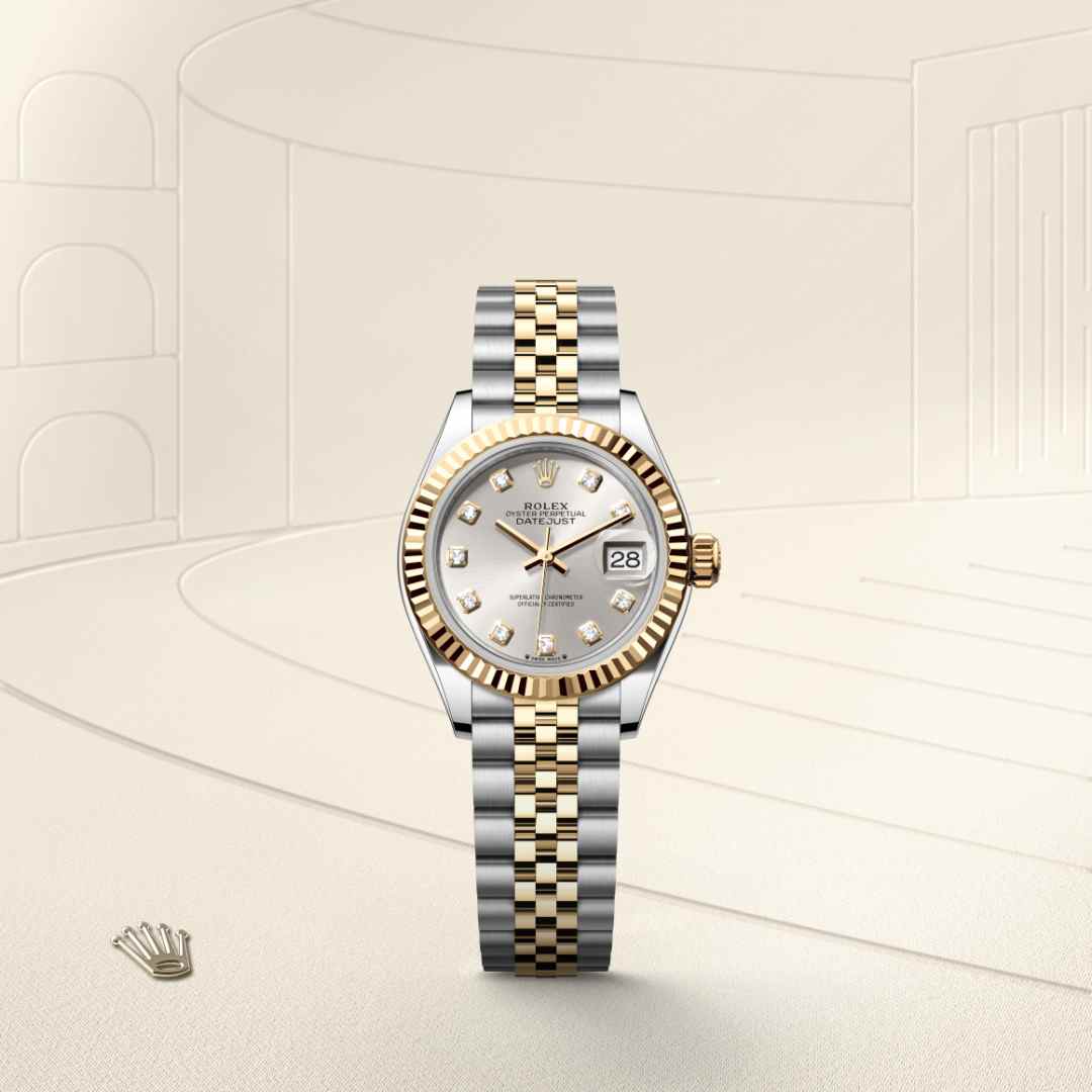 Rolex Lady-Datejust in Yellow Rolesor with a silver set with diamonds dial, fluted bezel, and Jubilee bracelet.