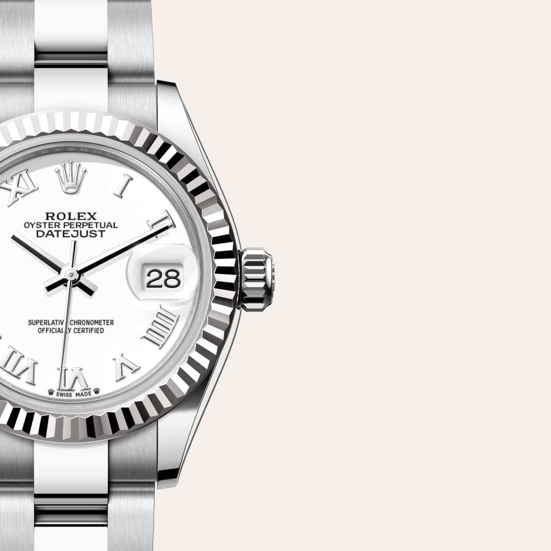 Rolex Lady-Datejust in White Rolesor with a white dial, fluted bezel, and Oyster bracelet.