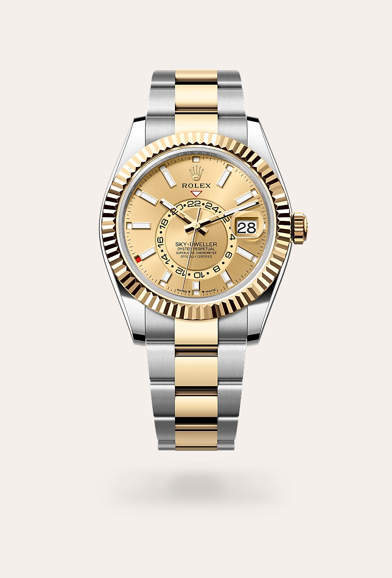Rolex Sky-Dweller in Yellow Rolesor with a champagne-colour dial, fluted, bidirectional rotatable rolex ring command bezel, and Oyster bracelet.
