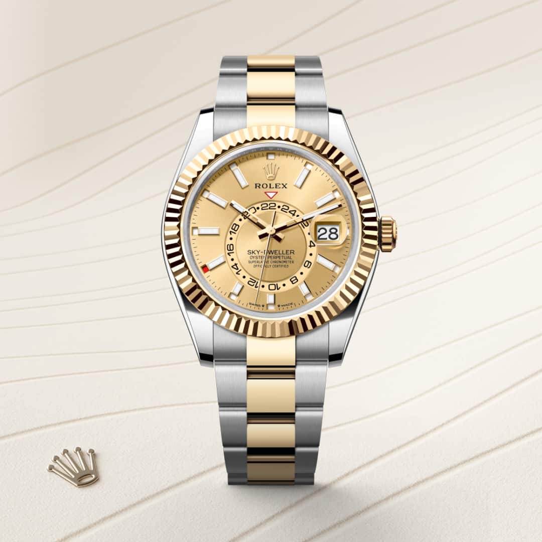 Rolex Sky-Dweller in Yellow Rolesor with a champagne-colour dial, fluted, bidirectional rotatable rolex ring command bezel, and Oyster bracelet.