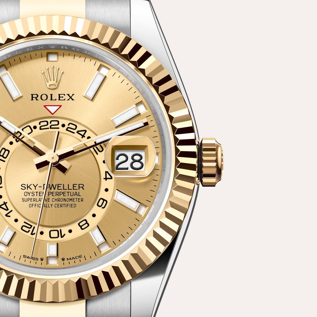 Rolex Sky-Dweller in Yellow Rolesor with a champagne-colour dial, fluted, bidirectional rotatable rolex ring command bezel, and Oyster bracelet.