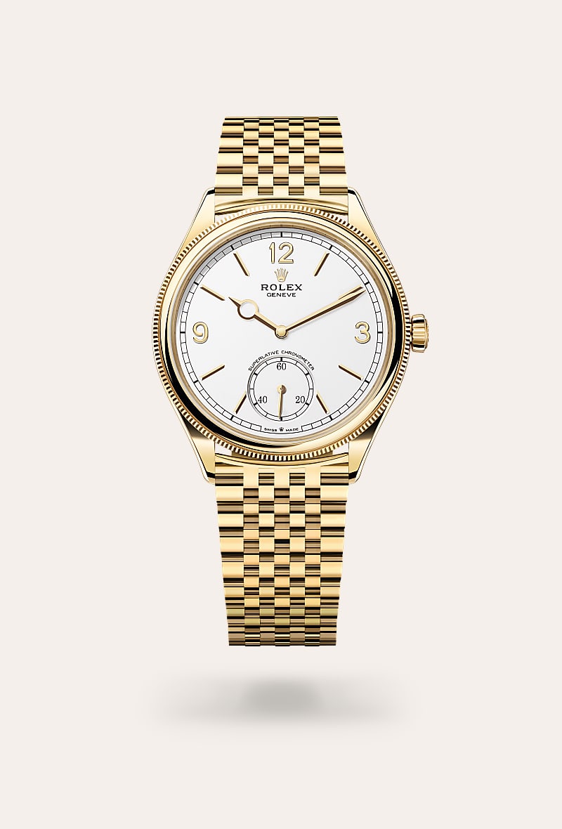 Rolex 1908 in 18 kt yellow gold with a intense white dial, domed and fluted bezel, and Settimo bracelet.