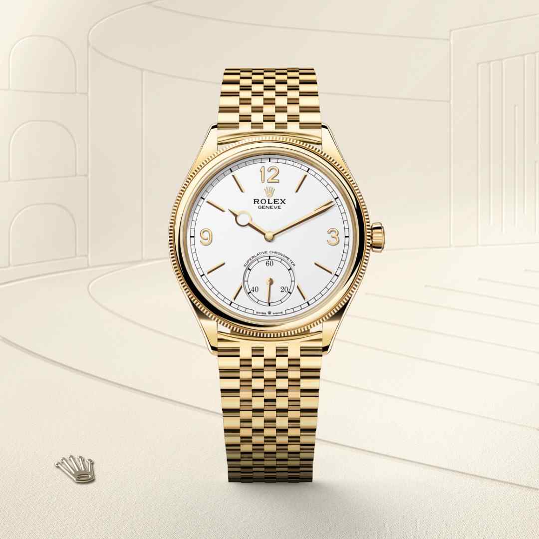 Rolex 1908 in 18 kt yellow gold with a intense white dial, domed and fluted bezel, and Settimo bracelet.