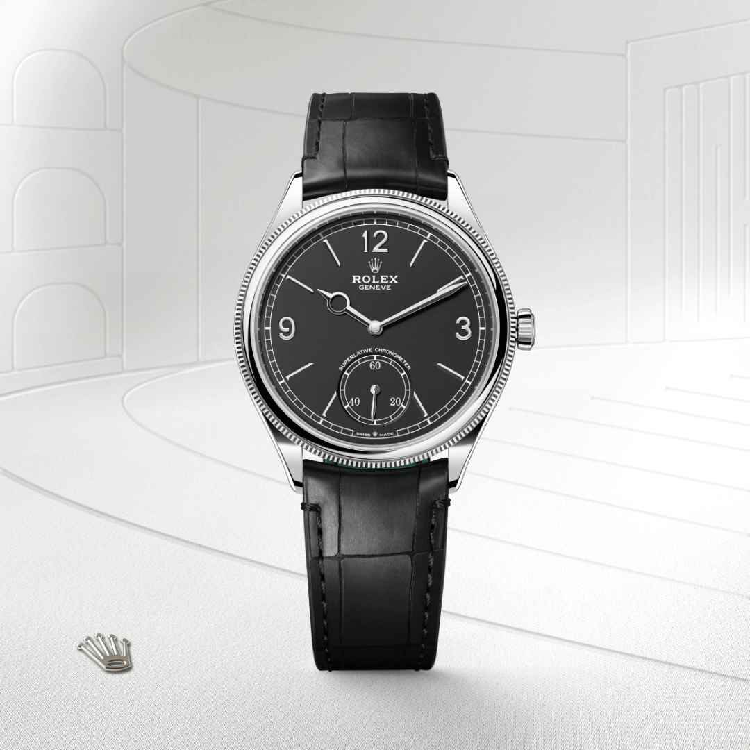 Rolex 1908 in 18 kt white gold with a intense black dial, domed and fluted bezel, and Leather strap bracelet.
