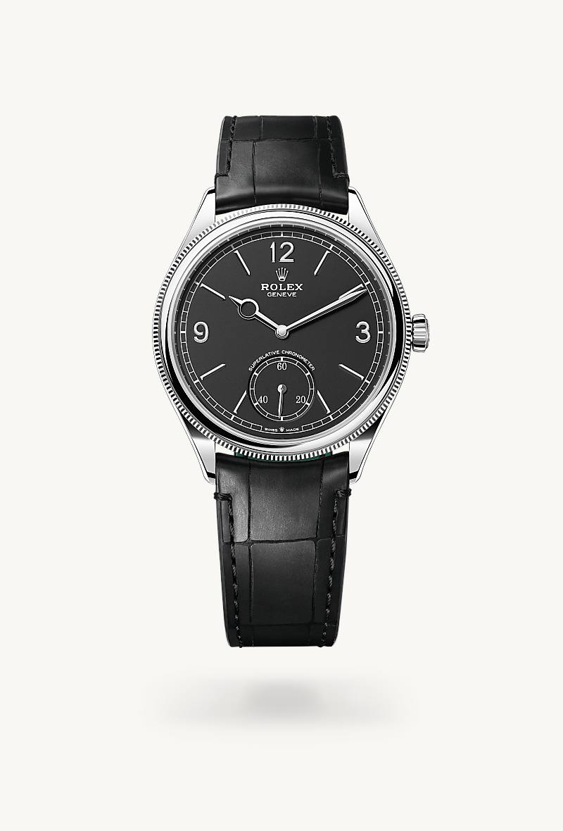 Rolex 1908 in 18 kt white gold with a intense black dial, domed and fluted bezel, and Leather strap bracelet.
