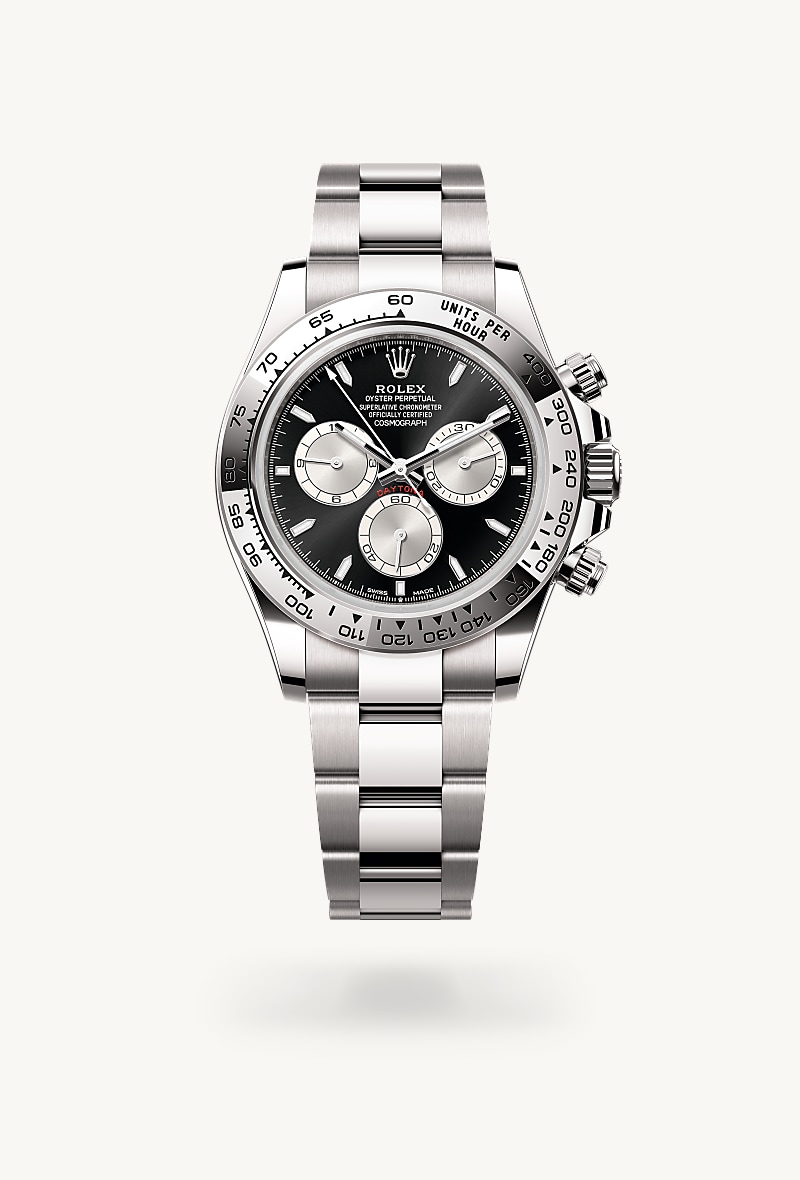 Rolex Cosmograph Daytona in 18 kt white gold with a bright black and steel dial, fixed, with engraved tachymetric scale, in 18 kt white gold bezel, and Oyster bracelet.
