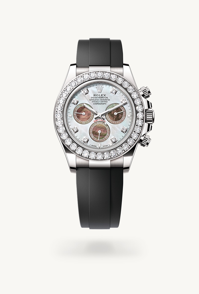 Rolex Cosmograph Daytona in 18 kt white gold with a white and black mother-of-pearl set with diamonds dial, set with diamonds bezel, and Oysterflex bracelet.