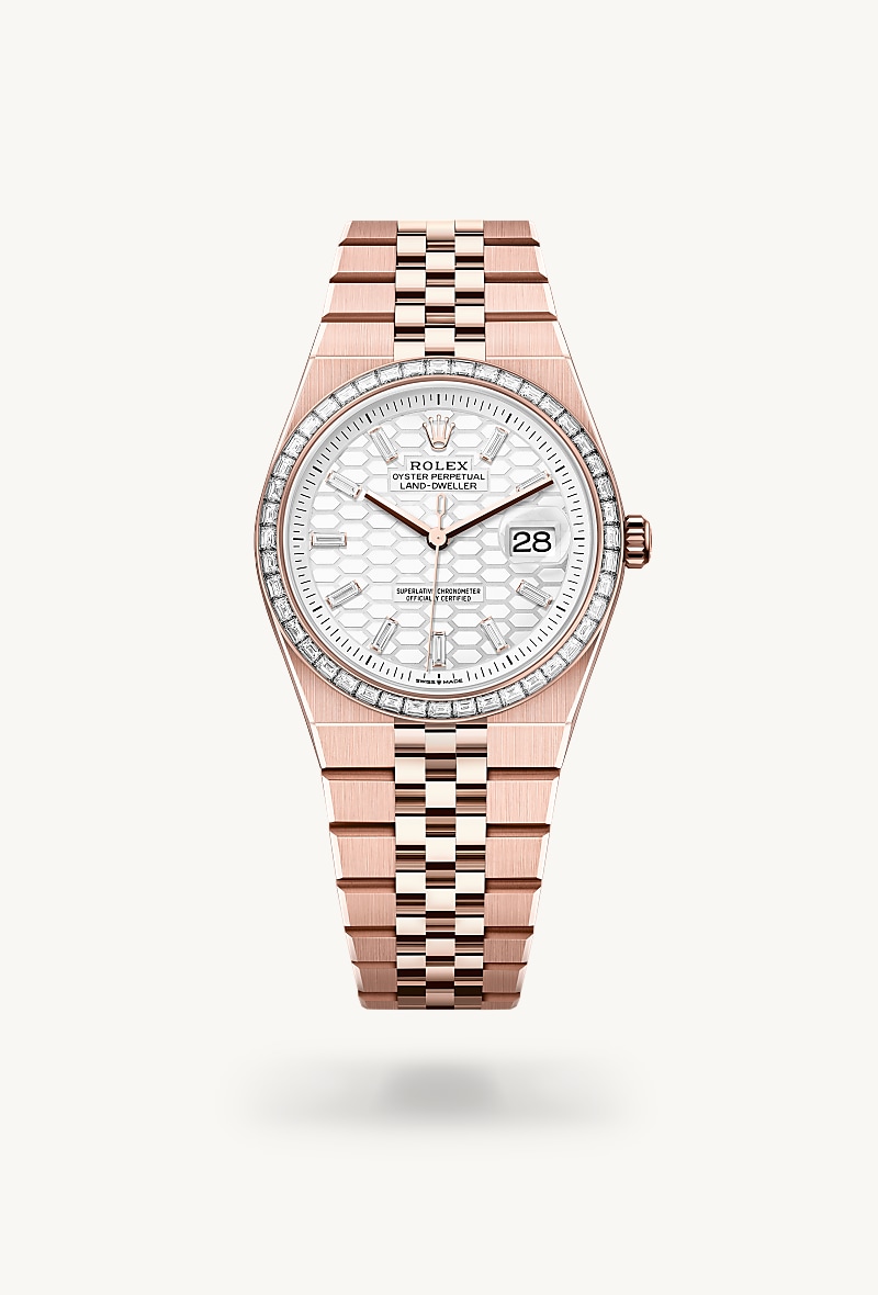 Rolex Land-Dweller 36 in 18 kt Everose gold with a intense white, honeycomb motif set with diamonds dial, set with diamonds bezel, and Flat Jubilee bracelet.