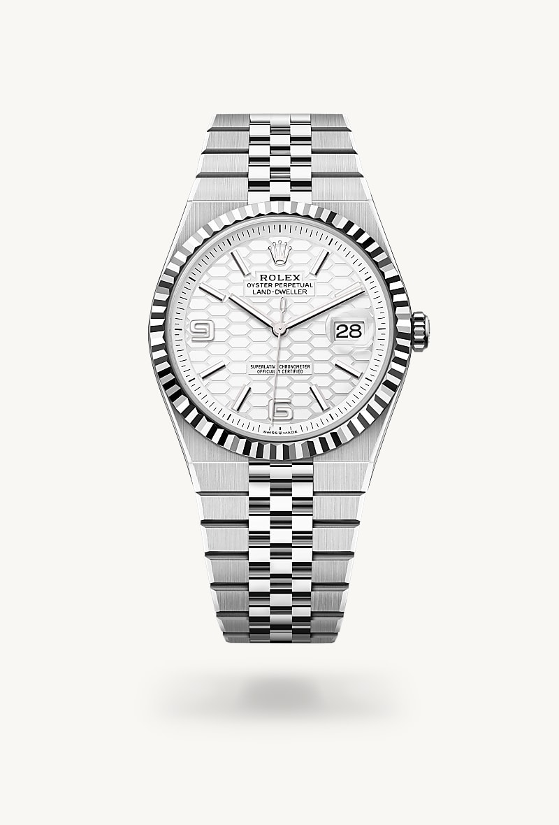 Rolex Land-Dweller 40 in White Rolesor with a intense white, honeycomb motif dial, fluted bezel, and Flat Jubilee bracelet.