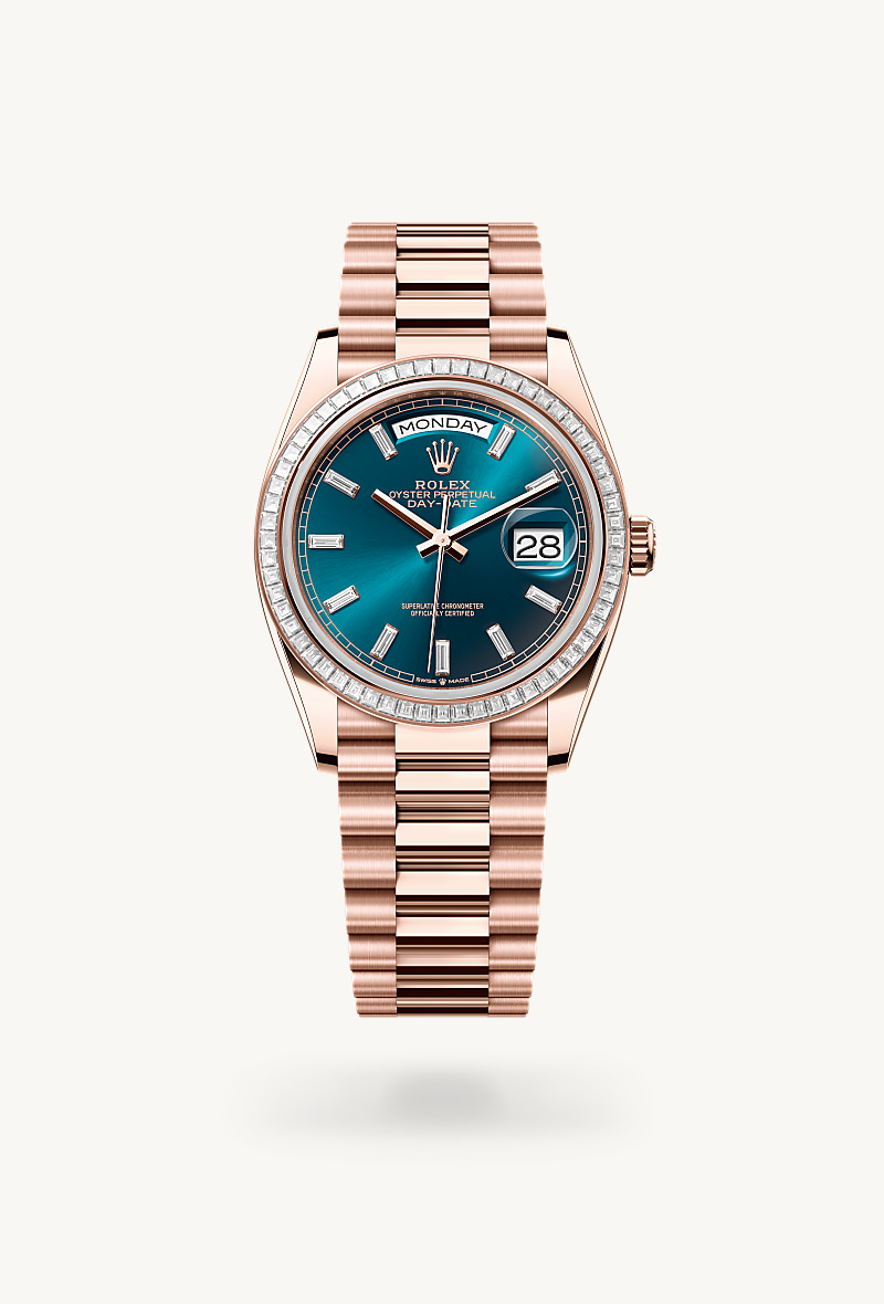 Rolex Day-Date 36 in 18 kt Everose gold with a blue-green set with diamonds dial, set with diamonds bezel, and President bracelet.