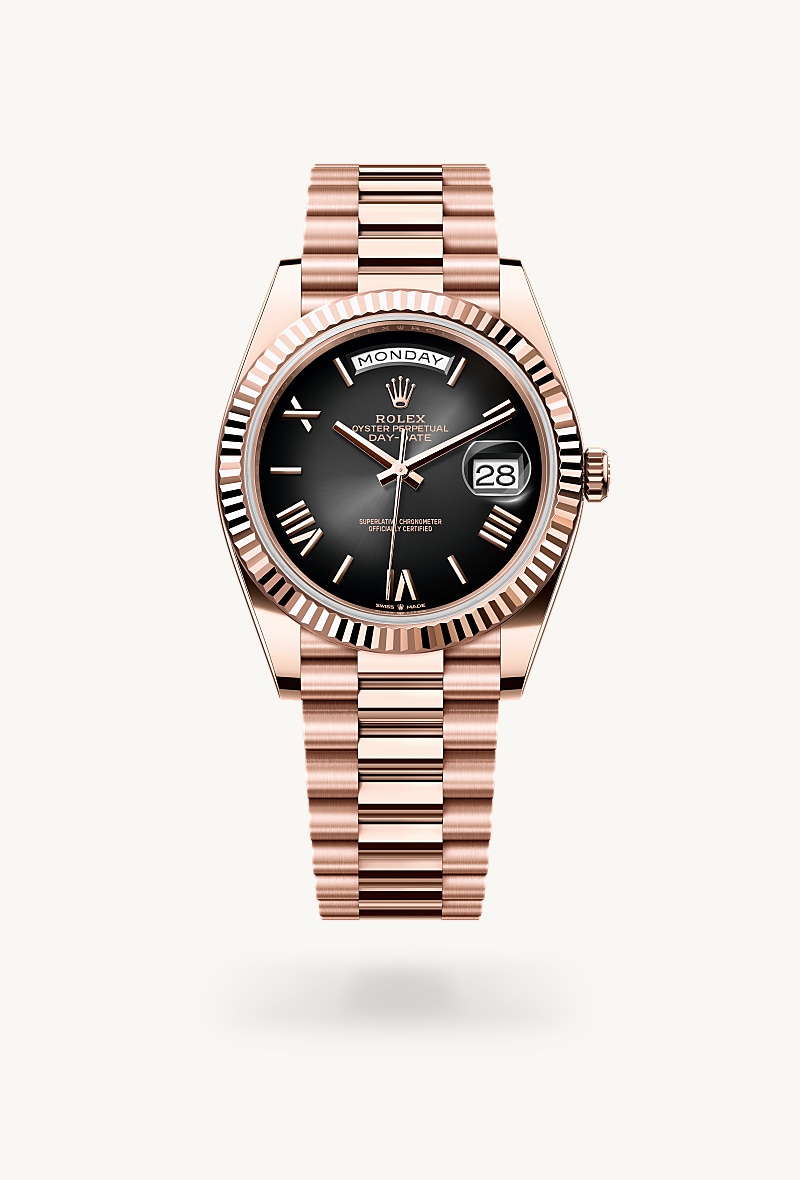 Rolex Day-Date 40 in 18 kt Everose gold with a slate ombré dial, fluted bezel, and President bracelet.