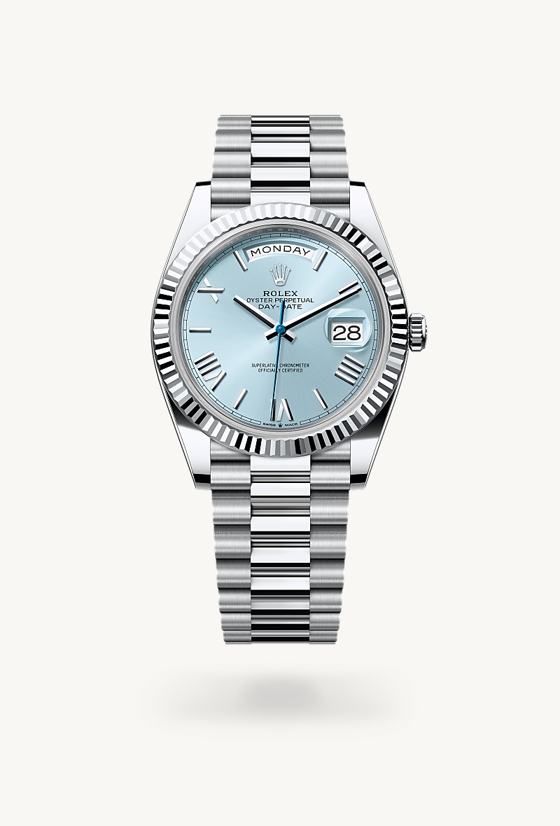 Rolex Day-Date 40 in Platinum with a ice blue dial, fluted bezel, and President bracelet.