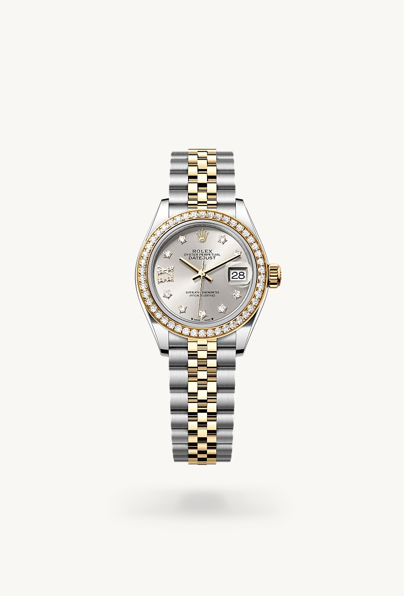 Rolex Lady-Datejust in Yellow Rolesor with a silver set with diamonds dial, set with diamonds bezel, and Jubilee bracelet.