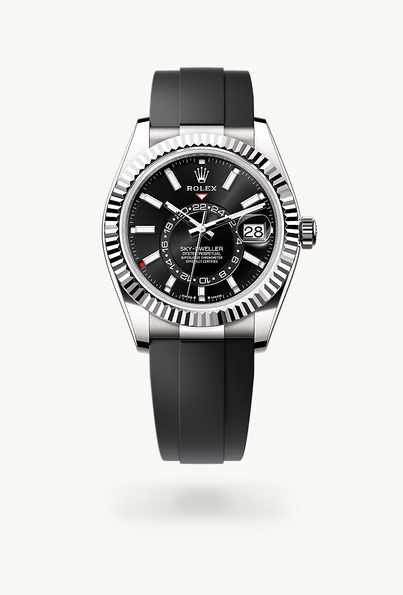 Rolex Sky-Dweller in 18 kt white gold with a bright black dial, fluted, bidirectional rotatable rolex ring command bezel, and Oysterflex bracelet.