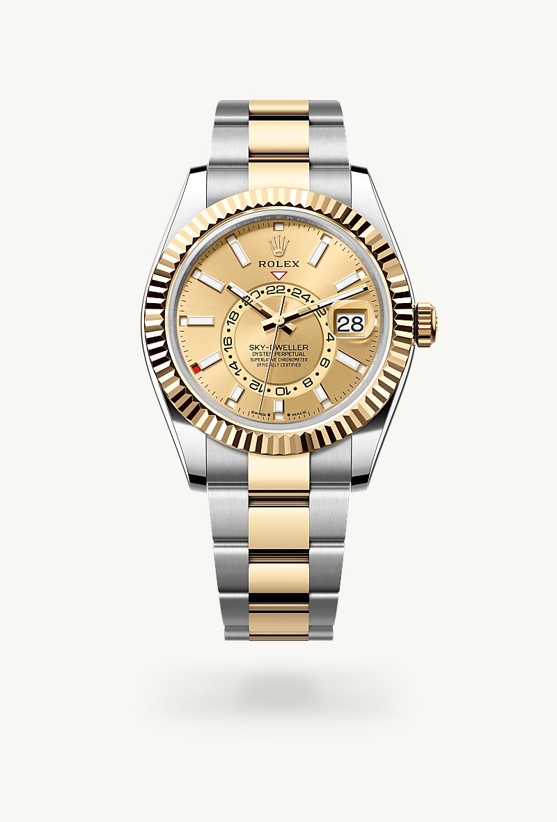 Rolex Sky-Dweller in Yellow Rolesor with a champagne-colour dial, fluted, bidirectional rotatable rolex ring command bezel, and Oyster bracelet.
