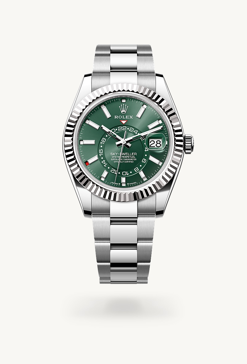 Rolex Sky-Dweller in White Rolesor with a mint green dial, fluted, bidirectional rotatable rolex ring command bezel, and Oyster bracelet.