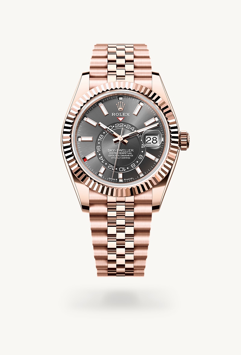 Rolex Sky-Dweller in 18 kt Everose gold with a slate dial, fluted, bidirectional rotatable rolex ring command bezel, and Jubilee bracelet.