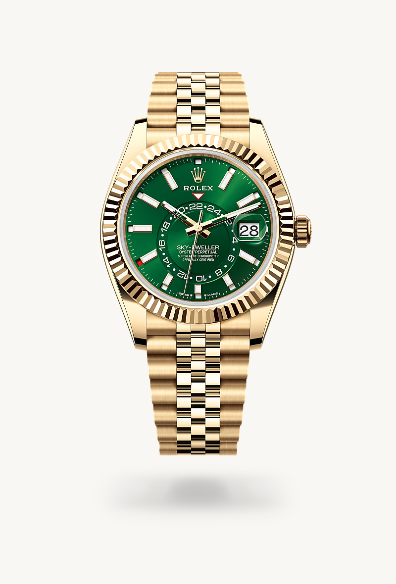 Rolex Sky-Dweller in 18 kt yellow gold with a bright green dial, fluted, bidirectional rotatable rolex ring command bezel, and Jubilee bracelet.