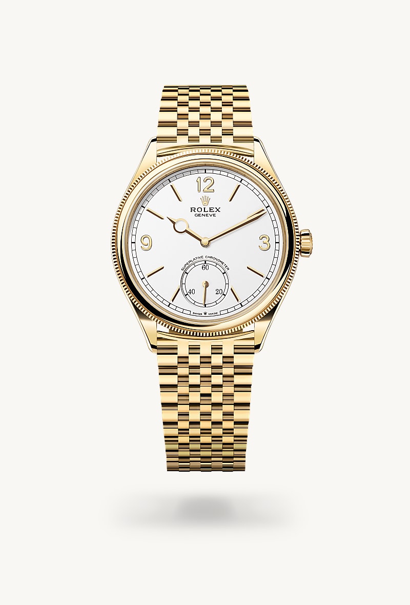 Rolex 1908 in 18 kt yellow gold with a intense white dial, domed and fluted bezel, and Settimo bracelet.