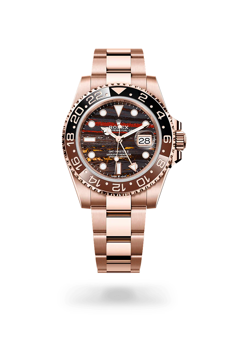 Rolex GMT-Master II in 18 kt Everose gold with a tiger iron dial, bidirectional rotatable 24-hour graduated bezel. two-colour brown and black cerachrom insert in ceramic, moulded numerals and graduations bezel, and Oyster bracelet.