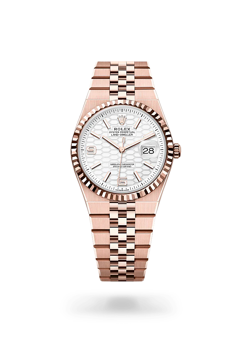 Rolex Land-Dweller 36 in 18 kt Everose gold with a intense white, honeycomb motif dial, fluted bezel, and Flat Jubilee bracelet.