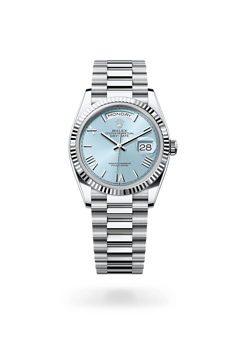 Rolex Day-Date 36 in Platinum with a ice blue dial, fluted bezel, and President bracelet.