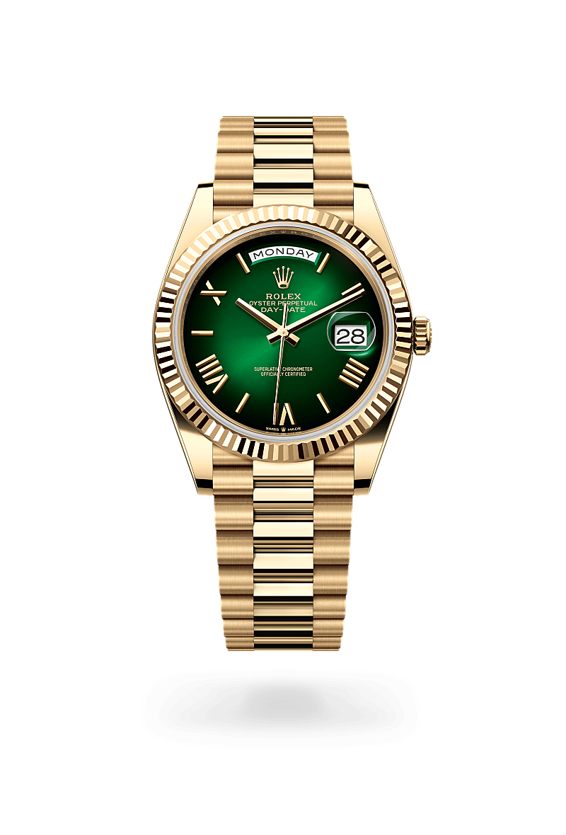 Rolex Day-Date 40 in 18 kt yellow gold with a green ombr&eacute; dial, fluted bezel, and President bracelet.