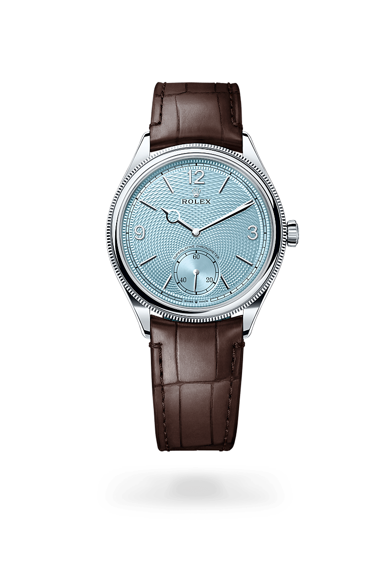 Rolex 1908 in Platinum with a ice blue, rice-grain motif dial, domed and fluted bezel, and Leather strap bracelet.