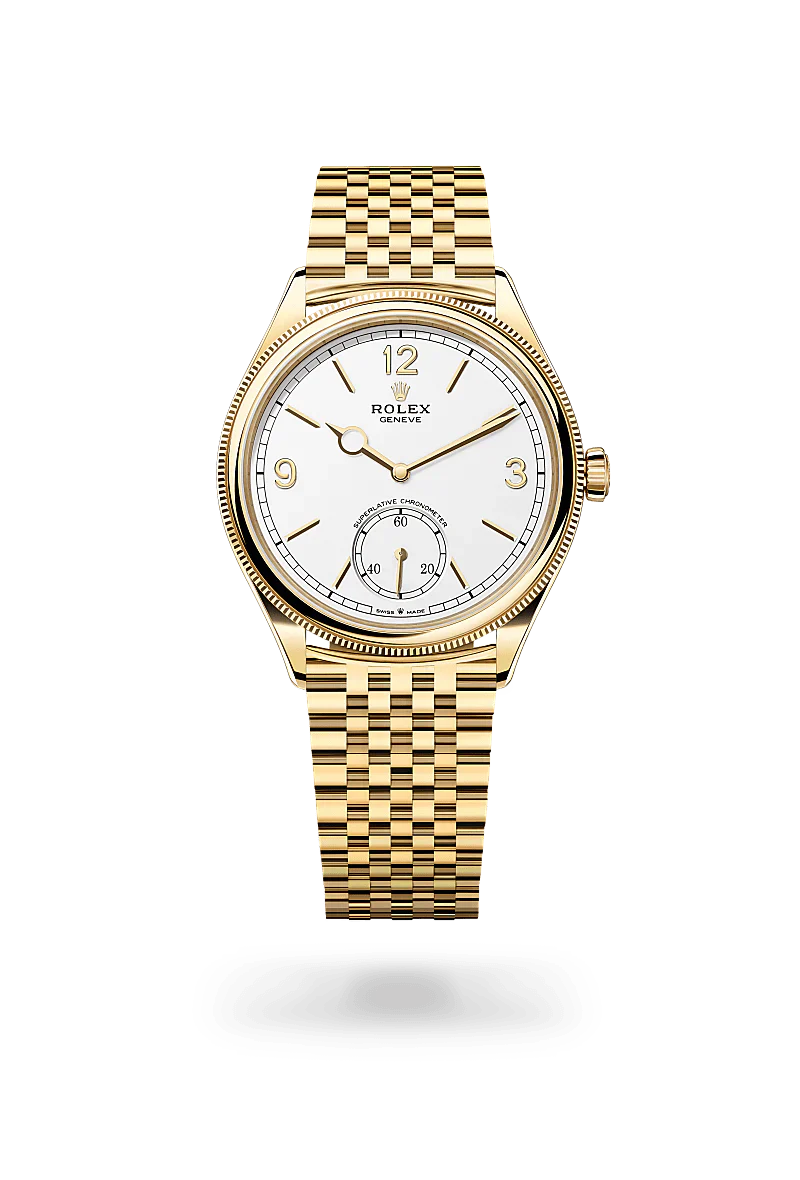 Rolex 1908 in 18 kt yellow gold with a intense white dial, domed and fluted bezel, and Settimo bracelet.