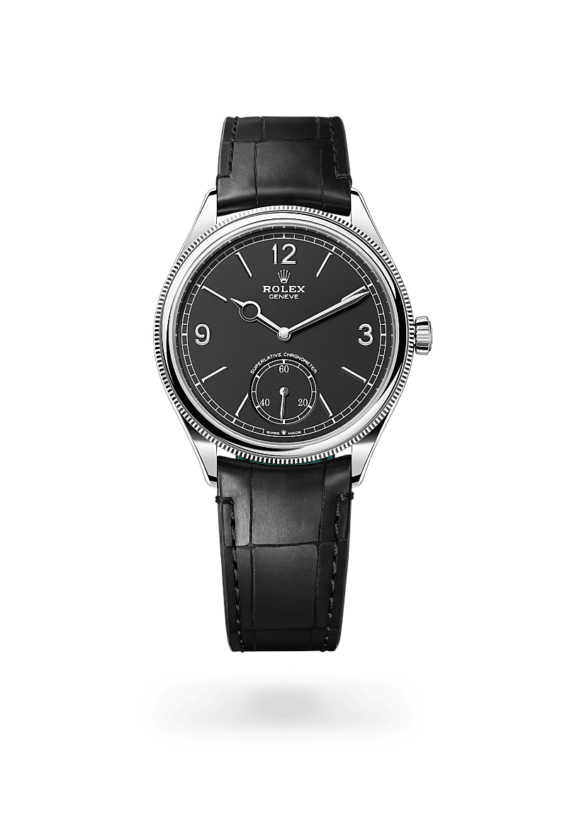 Rolex 1908 in 18 kt white gold with a intense black dial, domed and fluted bezel, and Leather strap bracelet.